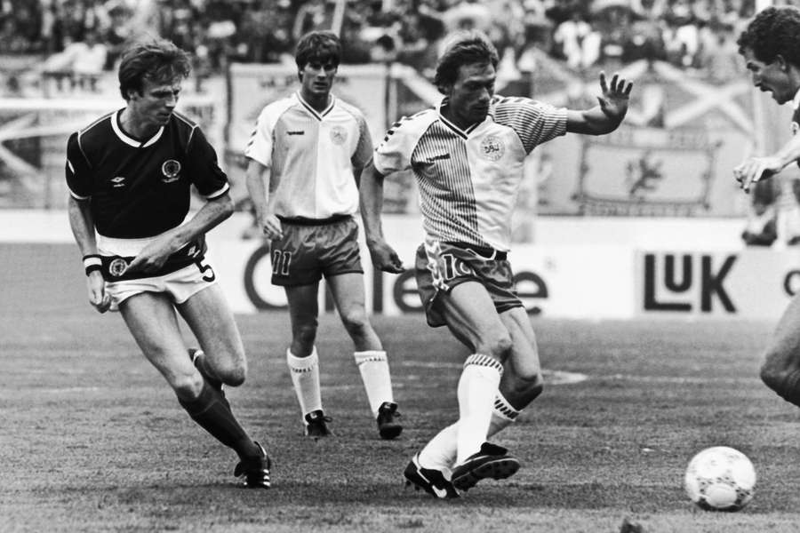 Preben Elkjaer, who scored for Denmark, is about to reach the ball, with Scotland’s Alexander McLeish on the left