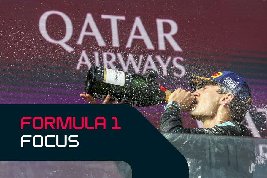 George Russell celebrates on the podium