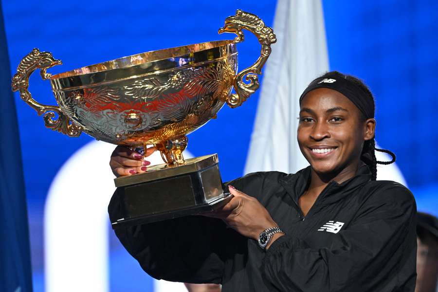 USA's Coco Gauff celebrates with the trophy after winning the women's singles final match against Czech Republic's Karolina Muchova 