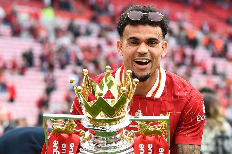 Liverpool player Luis Diaz celebrates with the Premier League trophy after the match between Liverpool and Crystal Palace