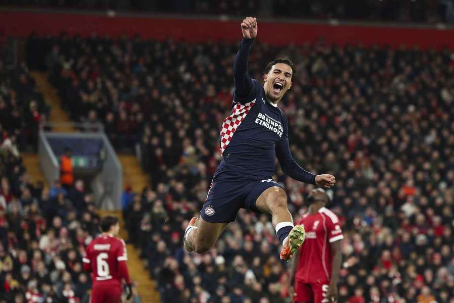 PSV's Couhaib Driouech celebrates scoring his team's third goal against Liverpool