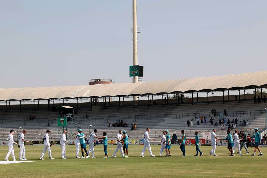 England and Pakistan's players shake hands after the game