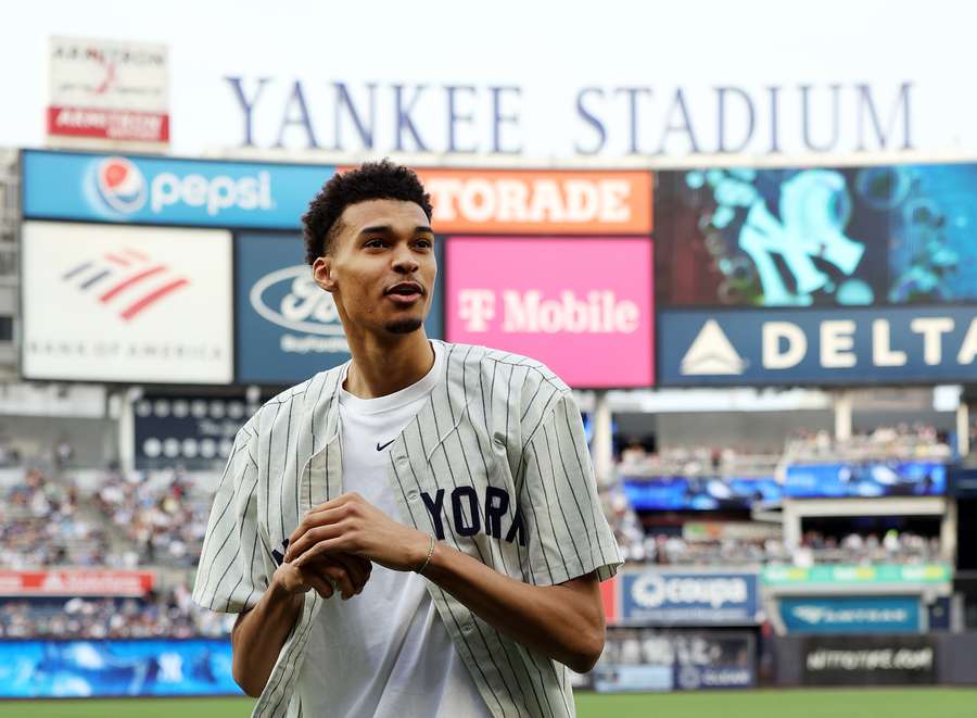 Victor Wembanyama, projected first round pick in the 2023 NBA draft, threw the ceremonial first pitch prior to the game between the Seattle Mariners and the New York Yankees at Yankee Stadium