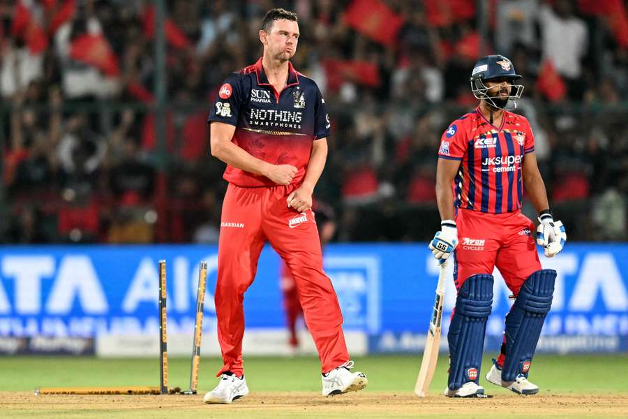 Big Joshy Hazlewood celebrates taking Nicholas Pooran's middle stump out overnight. 