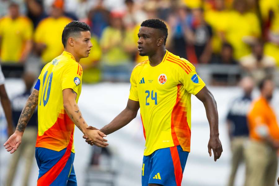 James Rodriguez and Jhon Cordoba celebrate a goal for Colombia in their quarter-final victory over Panama