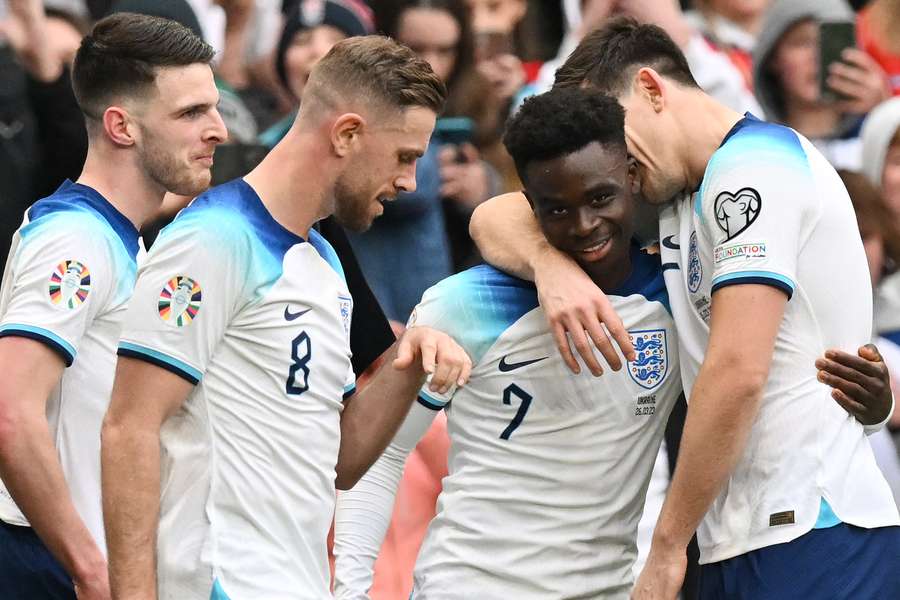 England's midfielder Bukayo Saka celebrates scoring his team's second goal 