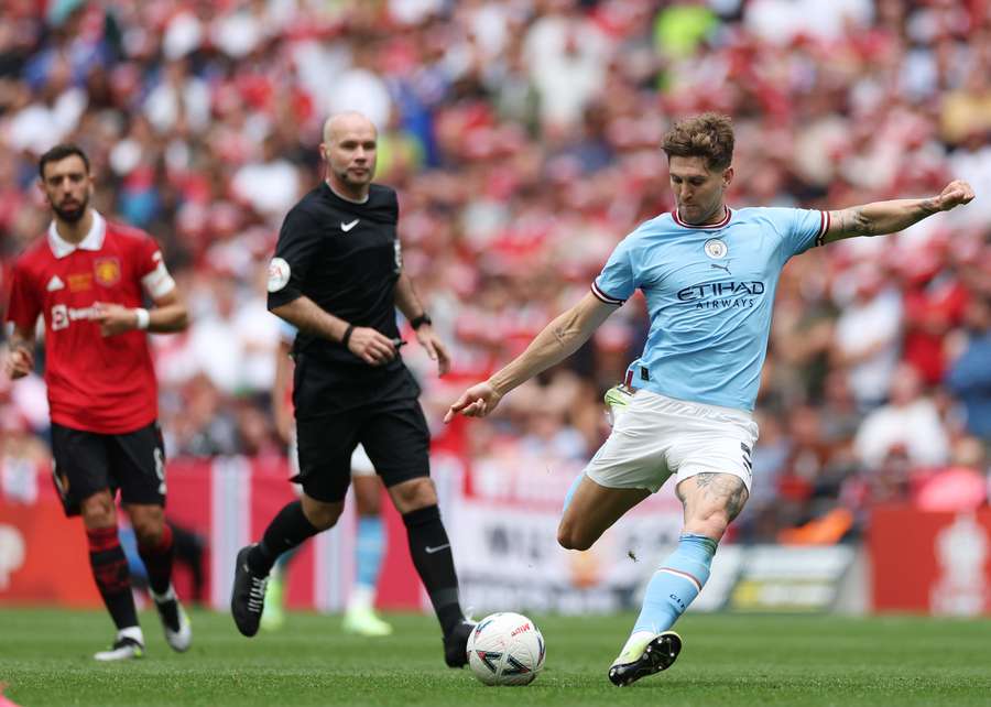 Manchester City defender John Stones shoots but fails to score