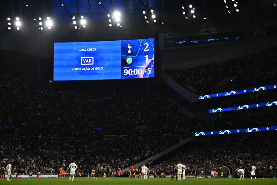 Players wait for a VAR decision on Harry Kane's goal that was evetually disallowed