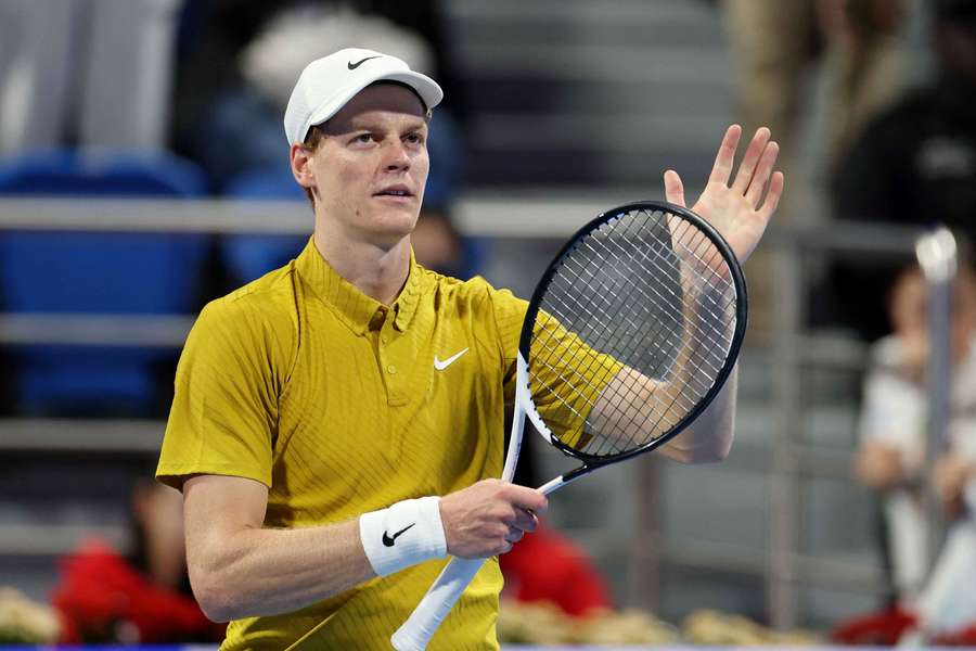 Jannik Sinner celebrates after winning his round of 16 match against Alexei Popyrin