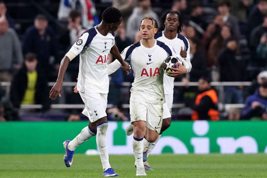 Tottenham Hotspur's Xavi Simons celebrates scoring their third goal with Pape Matar Sarr 
