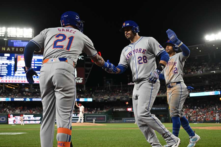 New York Mets designated hitter J.D. Martinez celebrates after hitting a three-run home run against the Washington Nationals