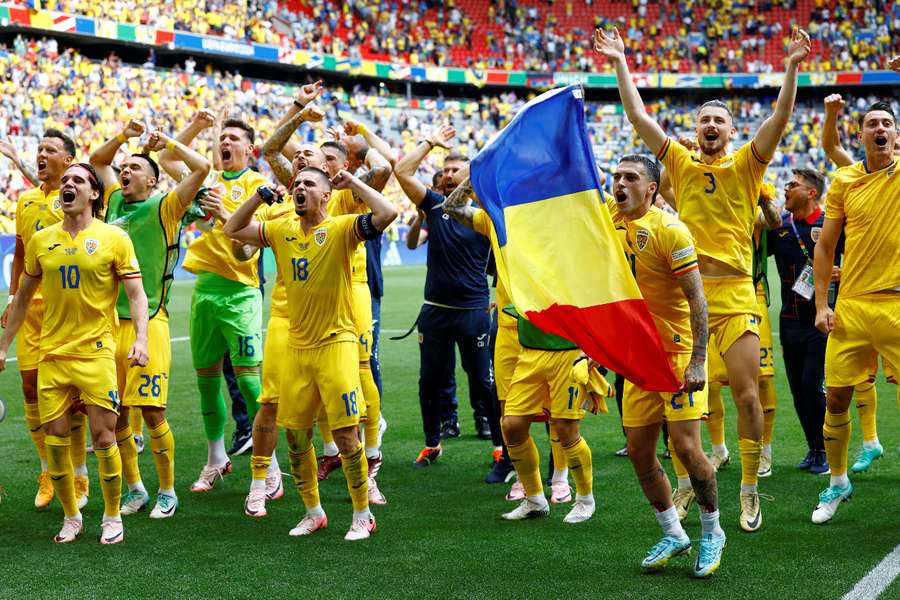 Romania celebrate their win