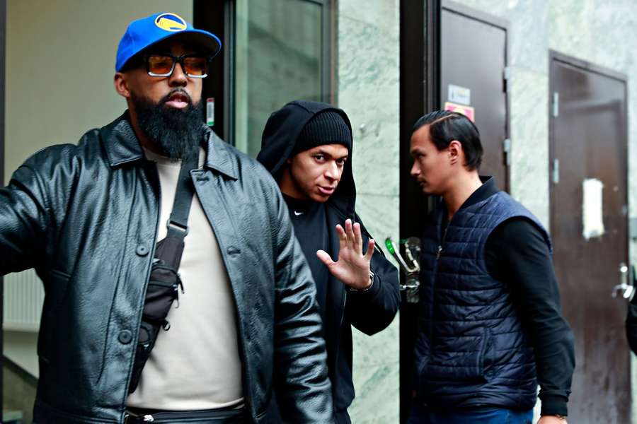 Injured French soccer player Kylian Mbappé leaves the Bank hotel where he has stayed during his visit to Stockholm