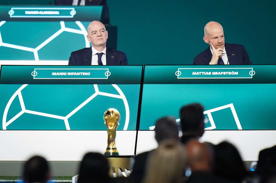 FIFA president Gianni Infantino, left, and FIFA Secretary General Mattias Grafstrom listen during the 76th FIFA Congress in Vancouver on Thursday