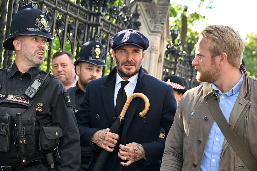 David Beckham joins thousands in 12-hour queue for Queen tributes