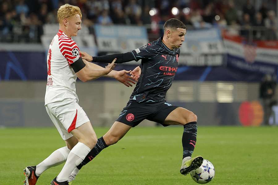 Foden vies for the ball in Leipzig