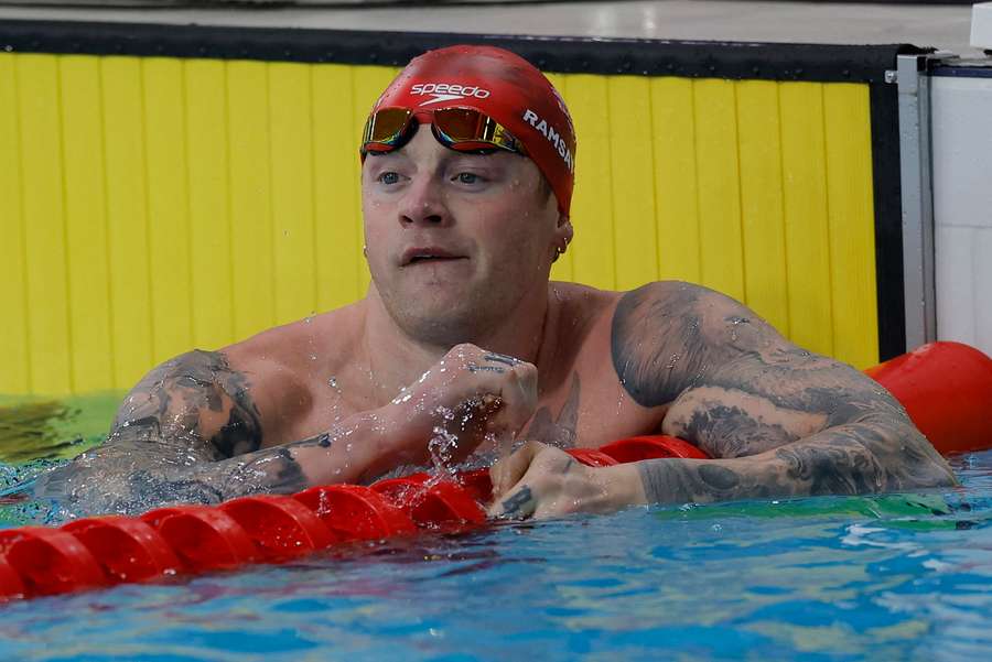 Adam Ramsay-Peaty reacts after the men's 50m breaststroke semi-final