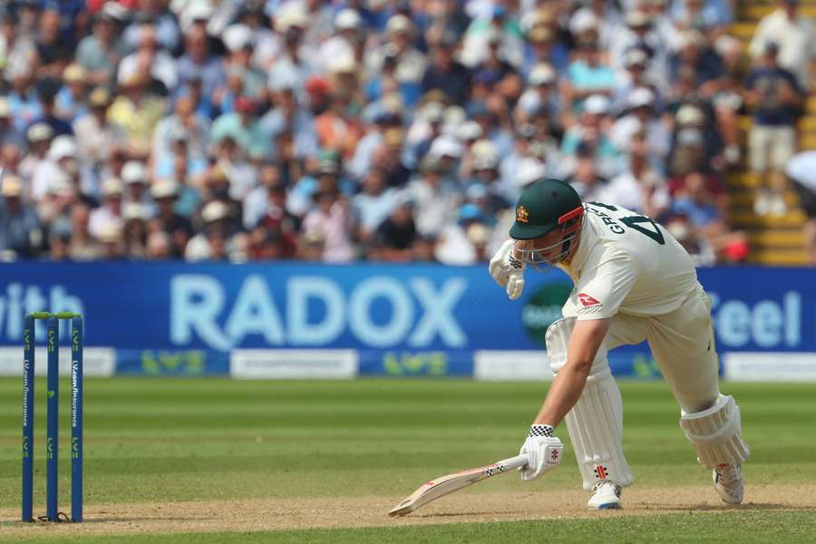 Australia's Cameron Green stretches to get back after England's Jonny Bairstow fails to collect a ball from England's Moeen Ali, therefore missing a stumping