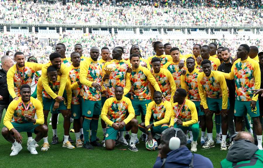 Senegal players celebrate with the Africa Cup of Nations trophy in Paris