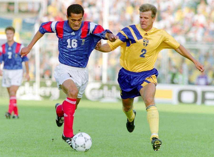 Pascal Vahirua of France and Roland Nilsson of Sweden battle for possession