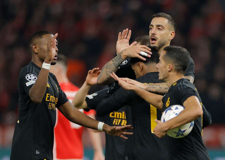 Real Madrid's Spanish forward #14 Joselu celebrates with teammates