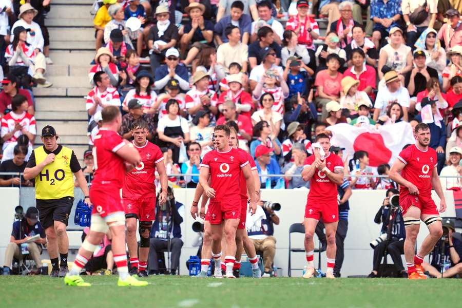 Wales players react after allowing a Japan try