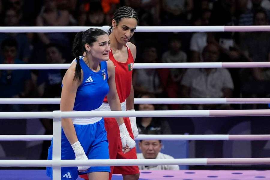 Algeria's Imane Khelif, right, defeated, Italy's Angela Carini in their women's 66kg preliminary boxing match 