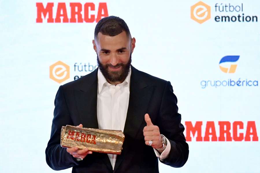 Real Madrid's French forward Karim Benzema poses after receiving the MARCA Leyenda (MARCA Legend) award in Madrid