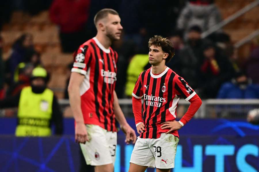 AC Milan's Joao Félix (right) reacts at the end of the UEFA Champions League knockout round playoff second-leg football match against Feyenoord