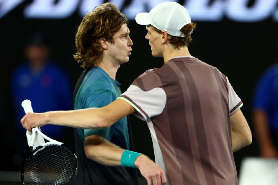 Rublev and Sinner embrace at the net