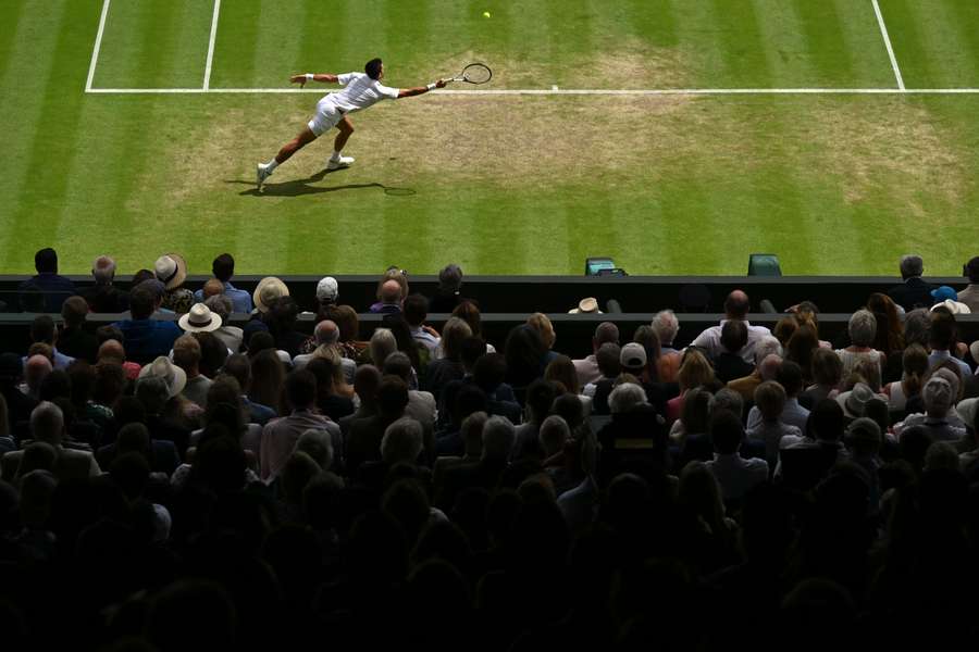 Novak Djokovic returns the ball to Hubert Hurkacz