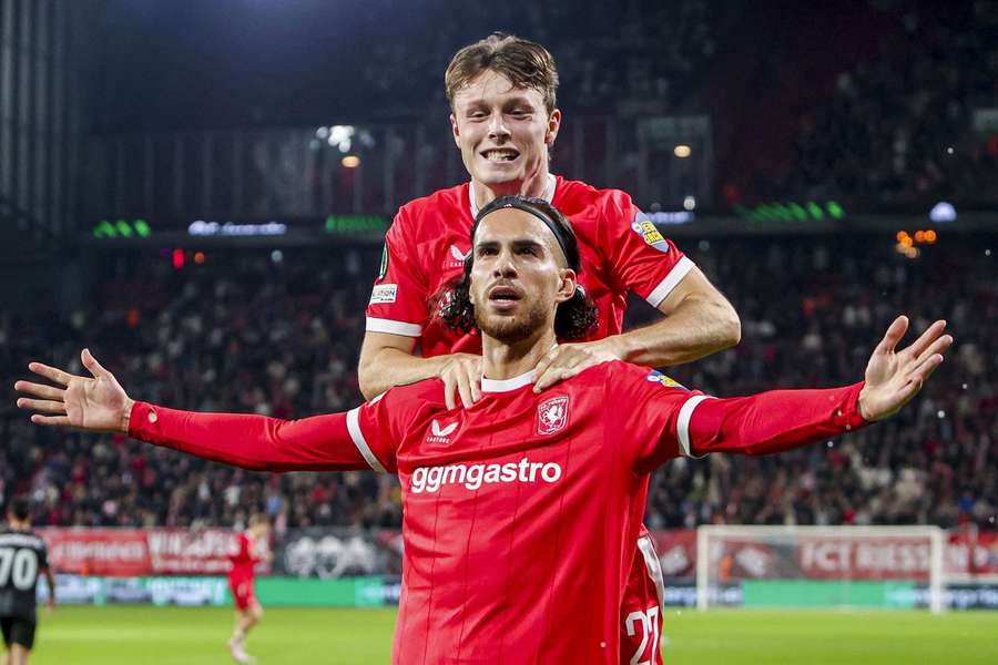FC Twente's Ramiz Zerrouki celebrates scoring against Thun with Sondre Orjasaeter