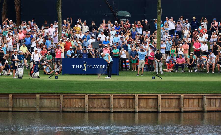 Scottie Scheffler of the United States plays his shot from the 17th tee 