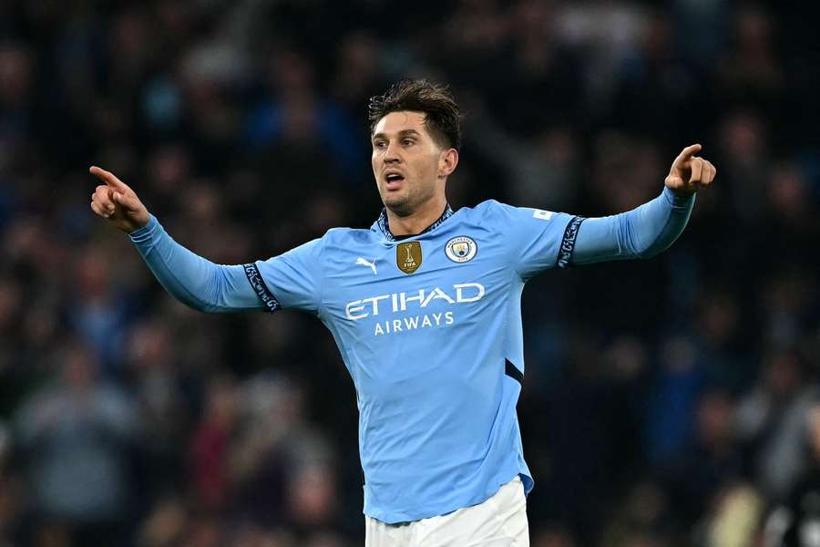 Manchester City's English defender #05 John Stones celebrates after scoring the equalising goal 