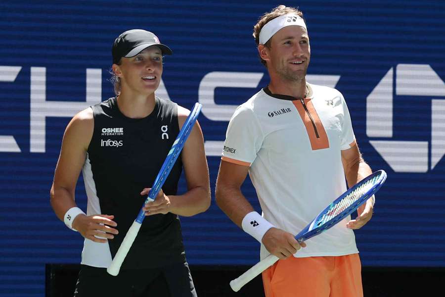 Norway's Casper Ruud (R) and Poland's Iga Swiatek react after a point against Madison Keys and Frances Tiafoe Norway's Casper Ruud (R) and Poland's Iga Swiatek react after a point against Madison Keys and Frances Tiafoe