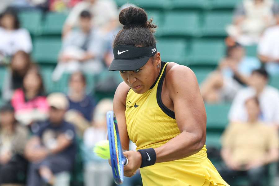 Naomi Osaka hits a return to Suzan Lamens in their match at the Japan Open in Osaka