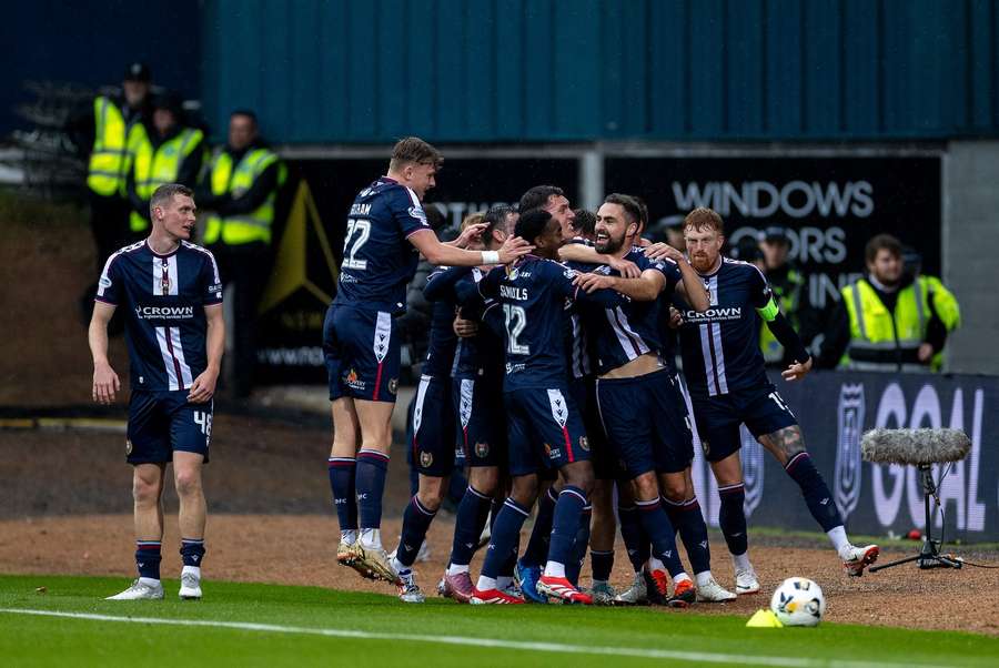 Clark Robertson celebrates with teammates after giving Dundee FC a shock lead inside the opening 18 minutes