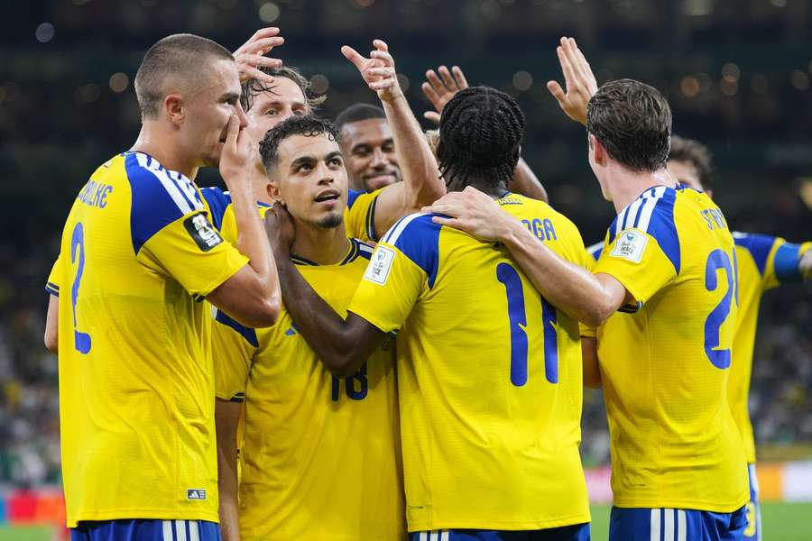 Sweden players celebrate against Tunisia Sweden players celebrate against Tunisia