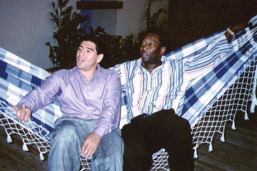 Diego Maradona and Pele rest on a hammock during a reception in Rio de Janeiro, Brazil, 1995