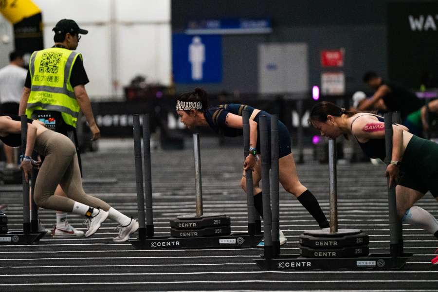 Participants seen competing during the now-viral Hyrox event in China. Participants seen competing during the now-viral Hyrox event in China.