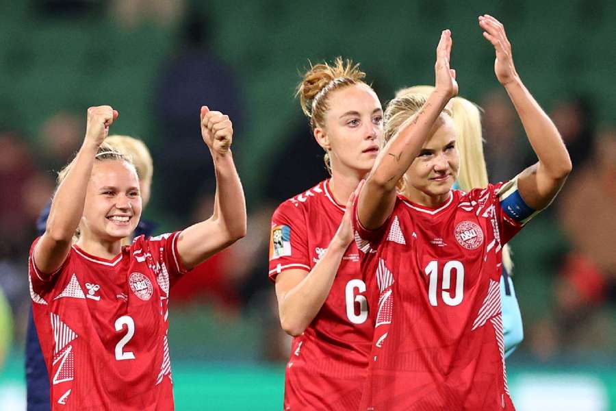 Denmark celebrate after beating China