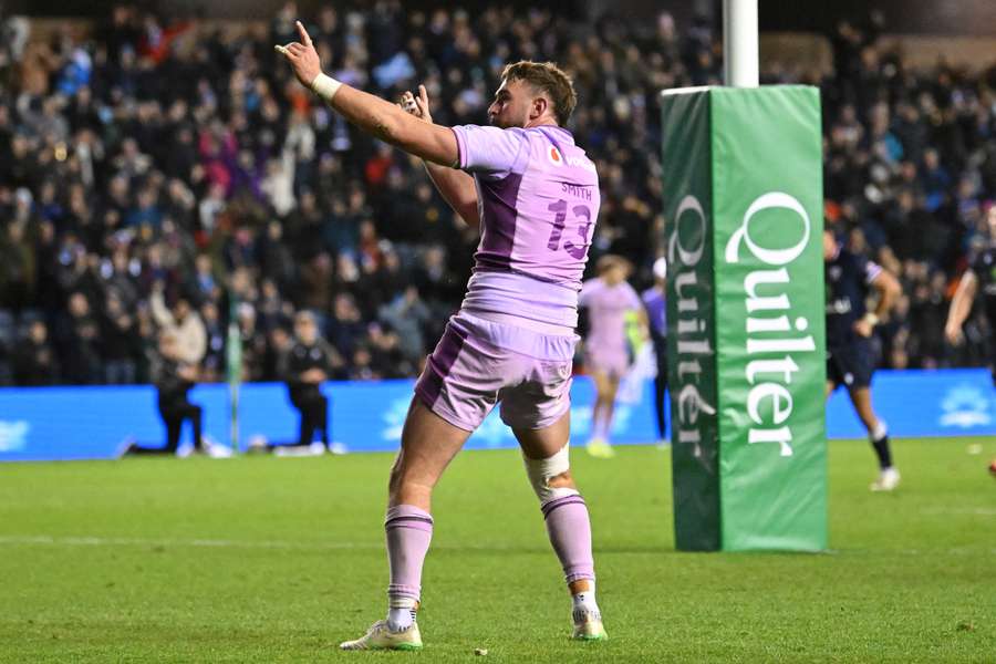 Ollie Smith celebrates a try scored during Scotland's 85-0 win over the US