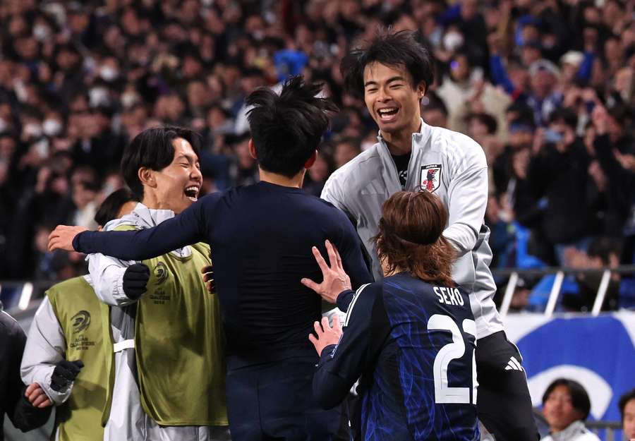 Japan's players celebrates their second goal