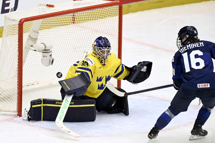Sweden's Emma Soderberg makes a save against Petra Nieminen of Finland 