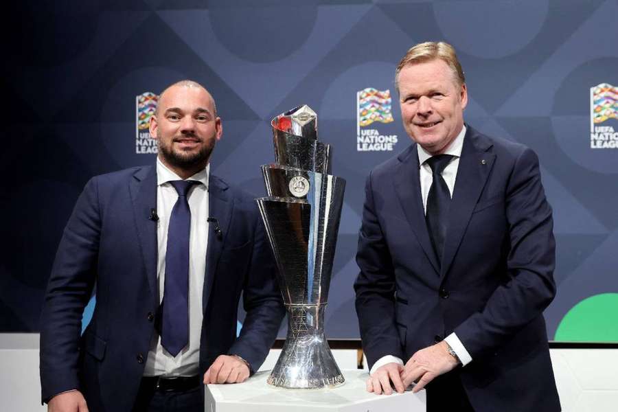 Netherlands coach Ronald Koeman with former player Wesley Sneijder during the draw