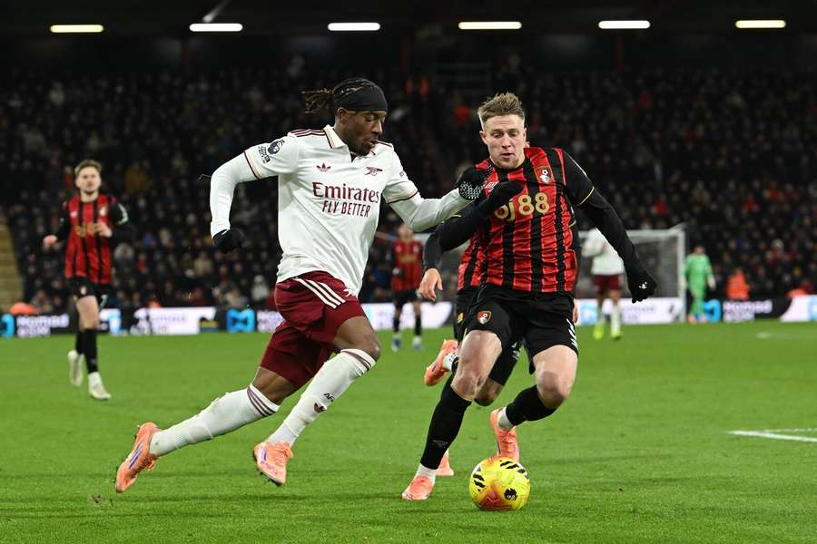 Arsenal's Noni Madueke tussles with Bournemouth's Adrien Truffert