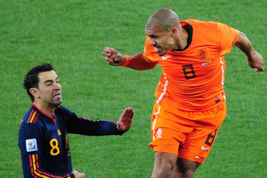 Nigel de Jong (R) and Xavi during the 2010 FIFA World Cup final