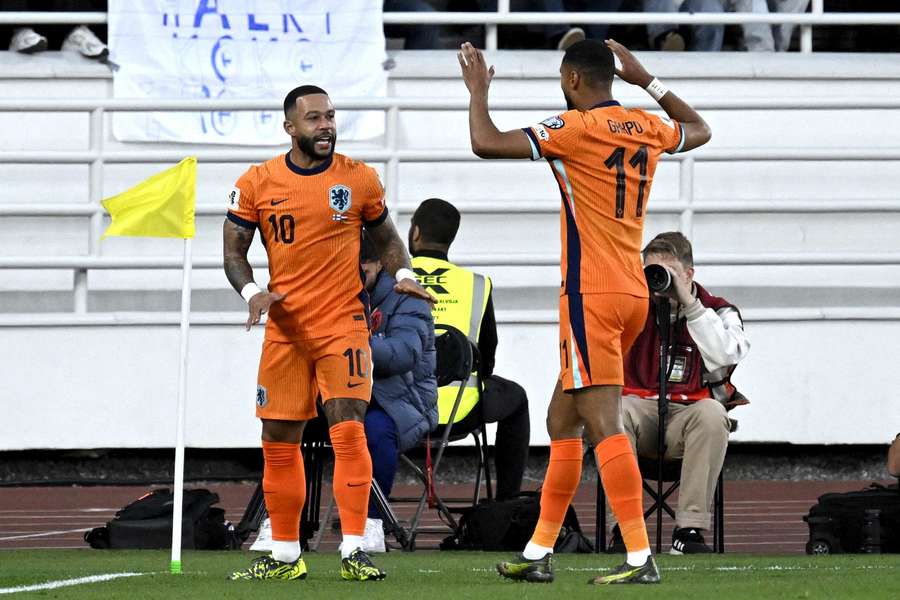 The Netherlands' Memphis Depay (L) opened the scoring in Helsinki