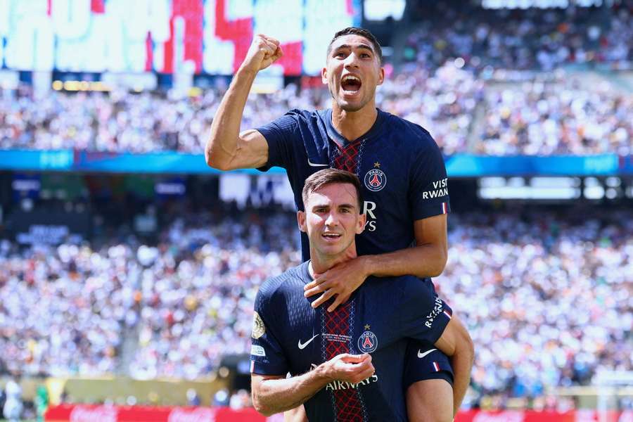 PSG players Fabian Ruiz and Achraf Hakimi celebrate during the Club World Cup semi-final against Real Madrid PSG players Fabian Ruiz and Achraf Hakimi celebrate during the Club World Cup semi-final against Real Madrid