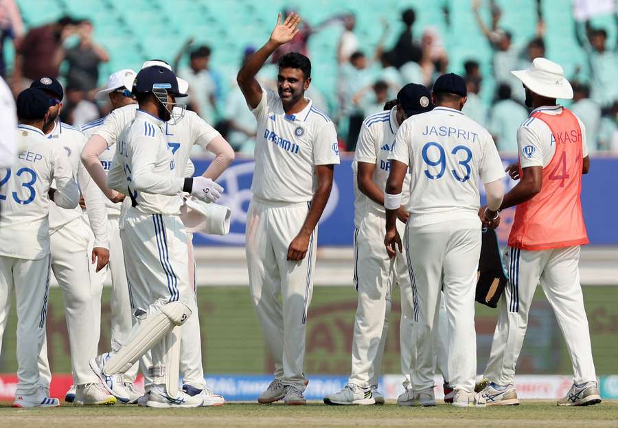 India's Ravichandran Ashwin celebrates with teammates after taking the wicket of England's Zak Crawley